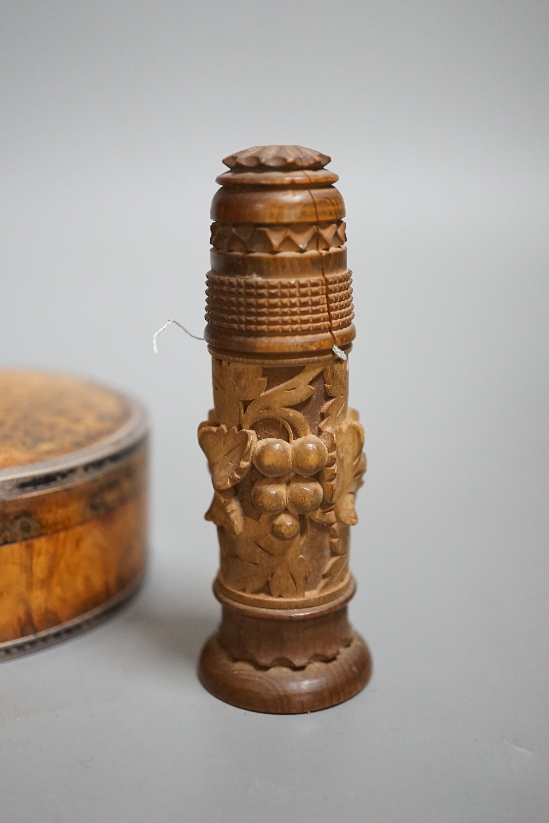 A 19th century circular white metal mounted burr wood snuff box and assorted small carvings